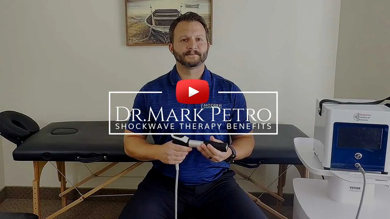 Dr. Mark Petro demonstrates shockwave therapy treatment for chronic pain at Modern Chiropractic in Fairview Park near Cleveland, Ohio.